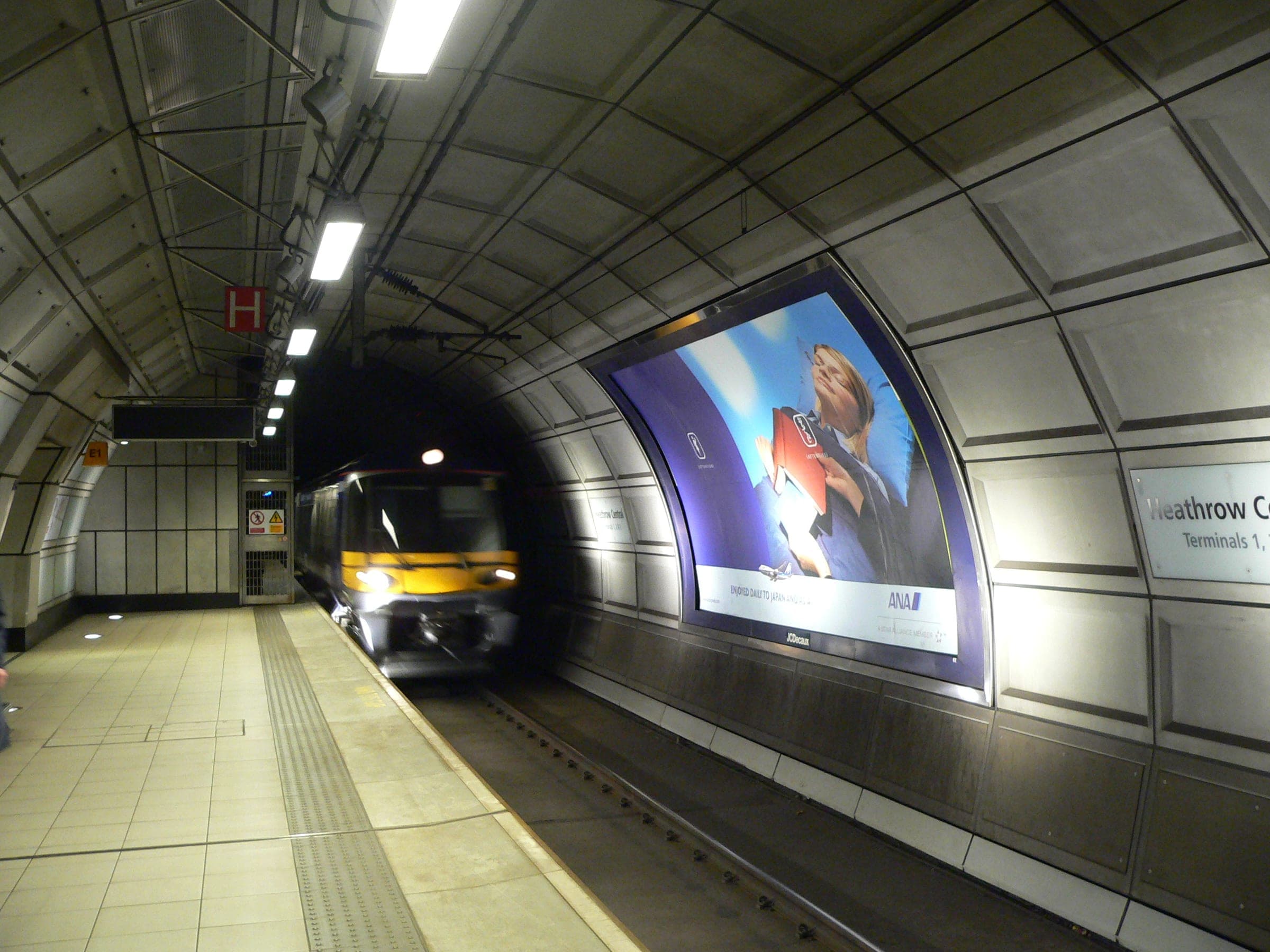 A Heathrow Express train arriving at its platform under the airport.