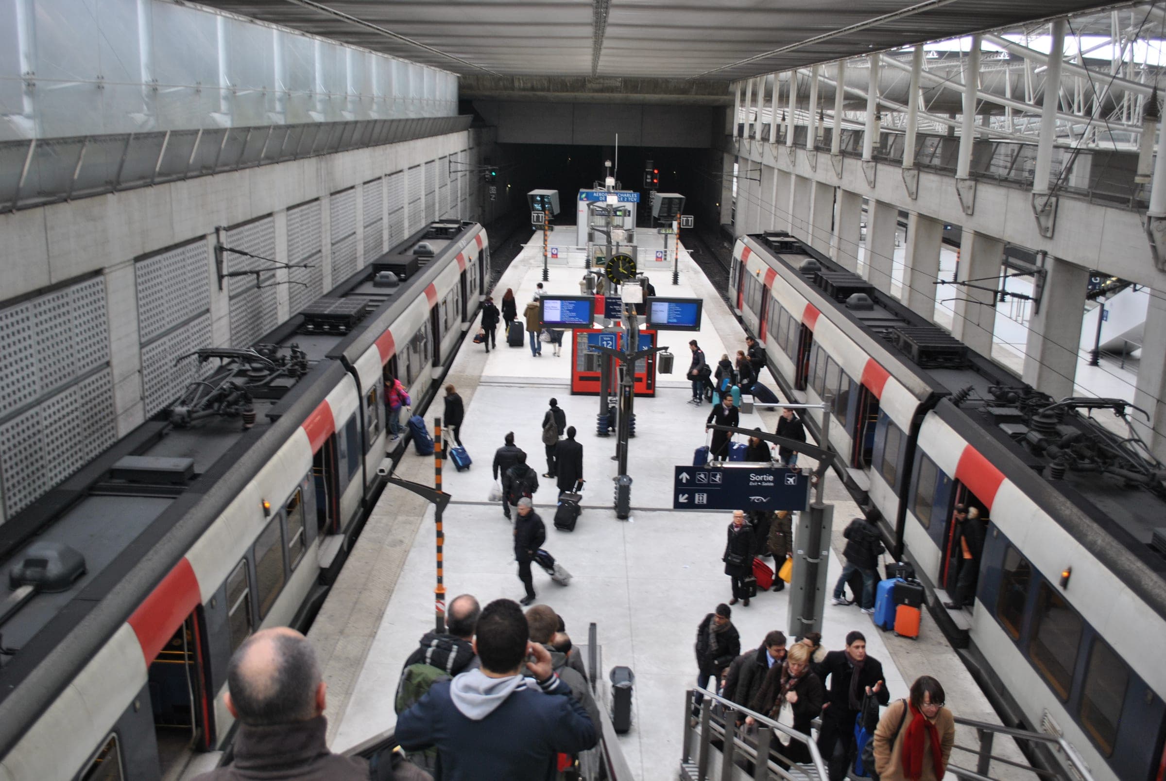 An RER B train at the platform of the Charles de Gaulle Airport station.